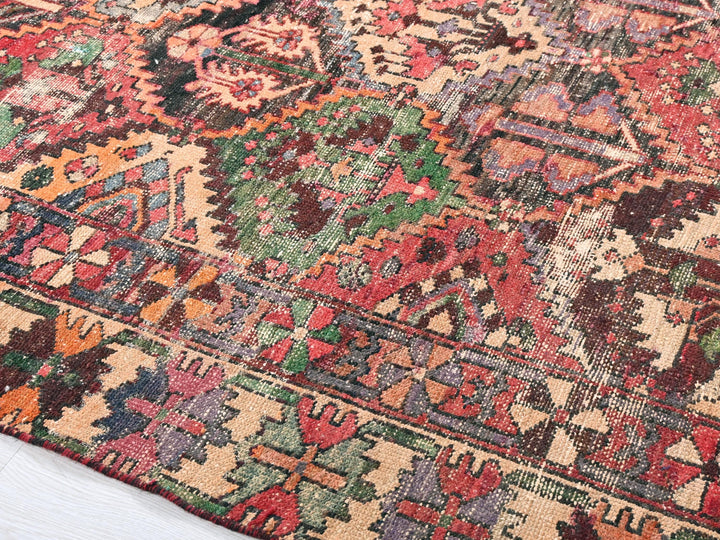 a multicolored oriental rug on a white floor