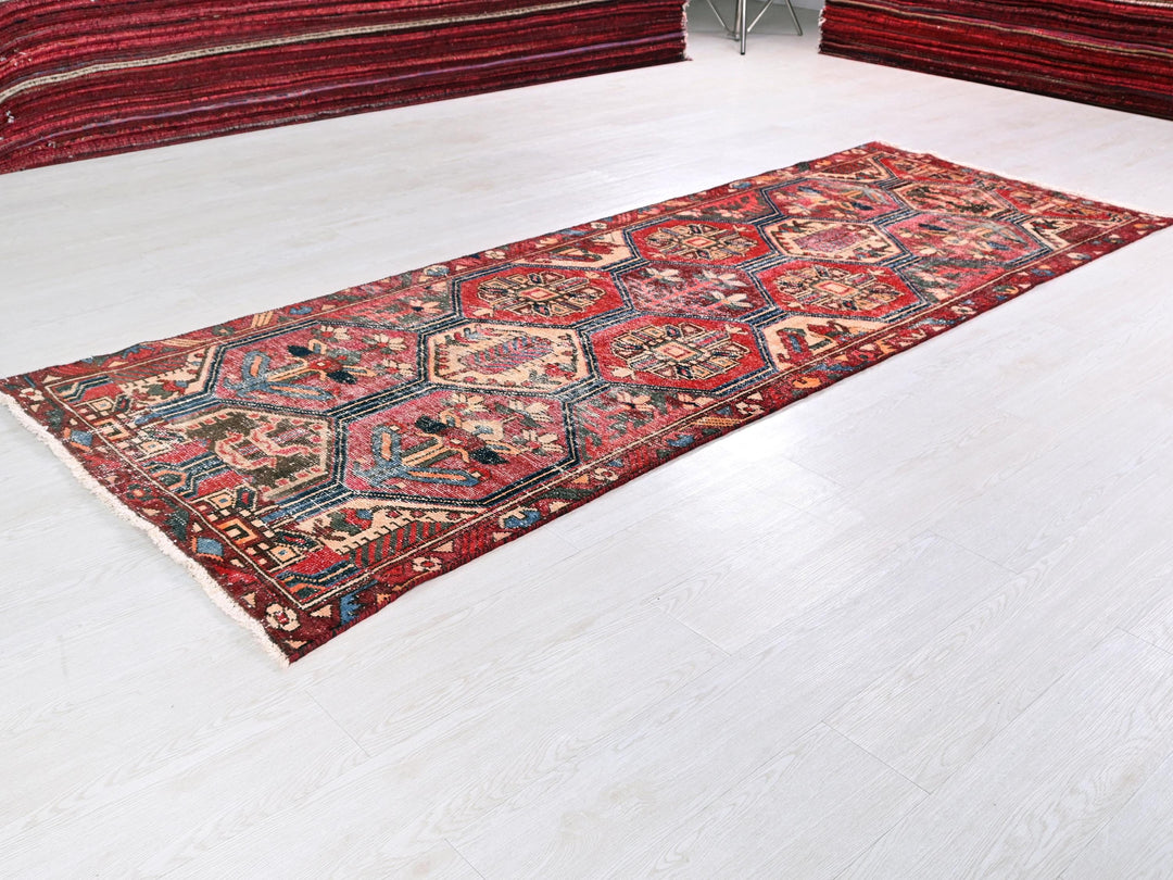 a red rug on a white floor in a room