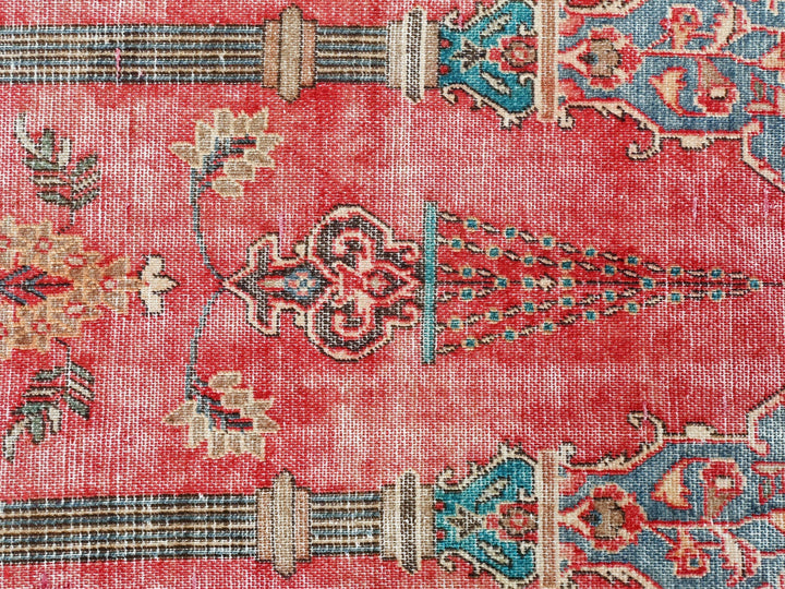 a close up of a rug with a red background