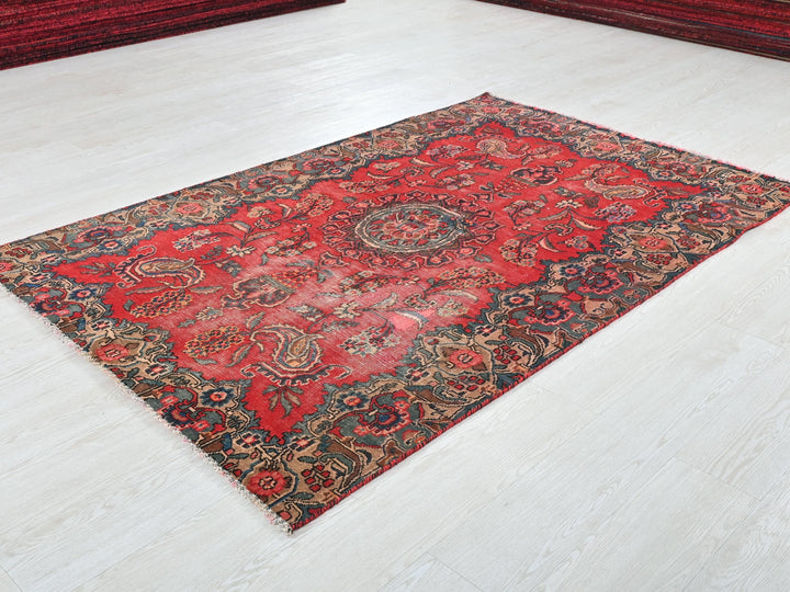 a red rug on the floor of a room