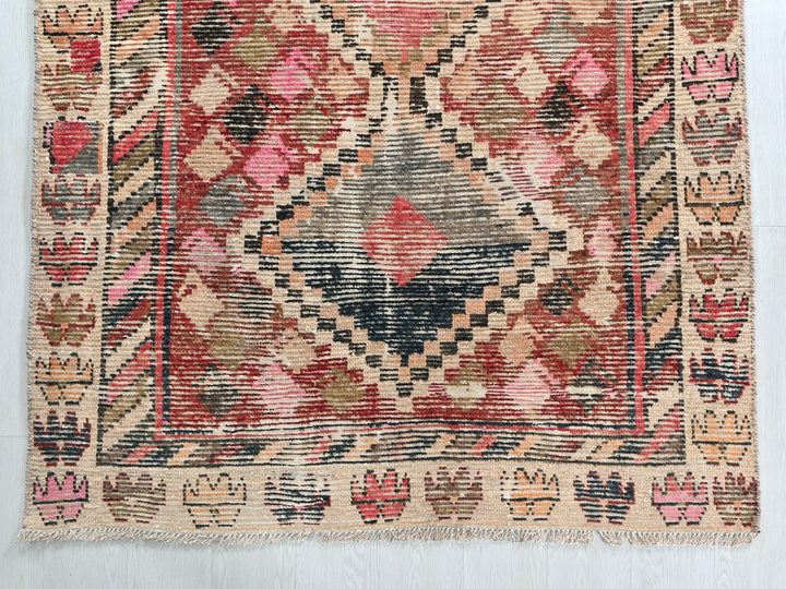 an old rug with a very colorful design on it