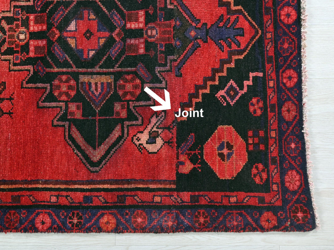 a close up of a rug with a white arrow pointing to it