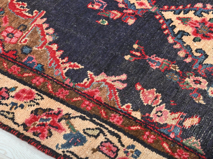 a close up of a rug on a wooden floor