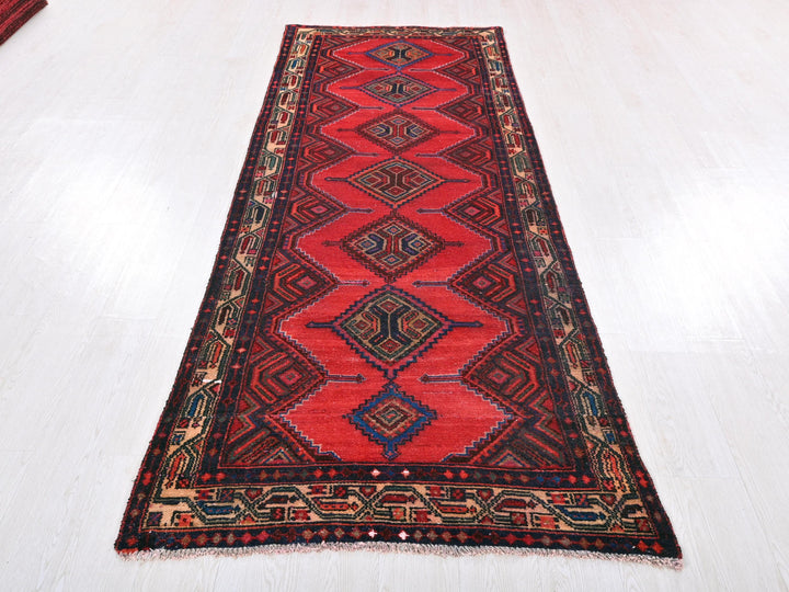 a red runner rug on a white floor