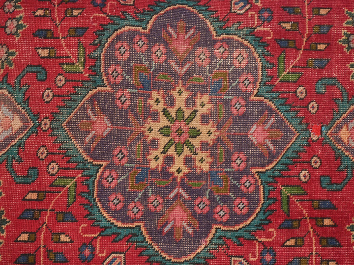 a close up of a rug with a flower design on it