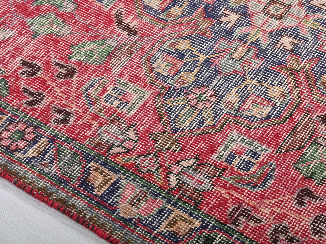 a close up of a rug on a white surface