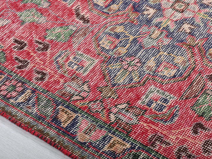 a close up of a rug on a white surface