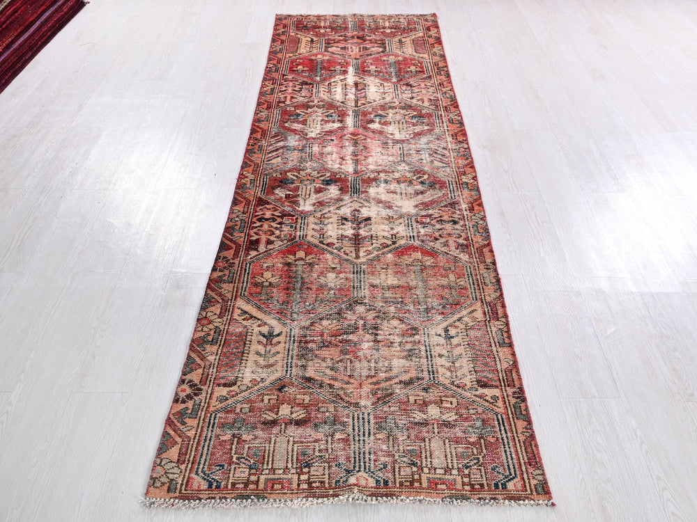 a long rug on a white floor in a room