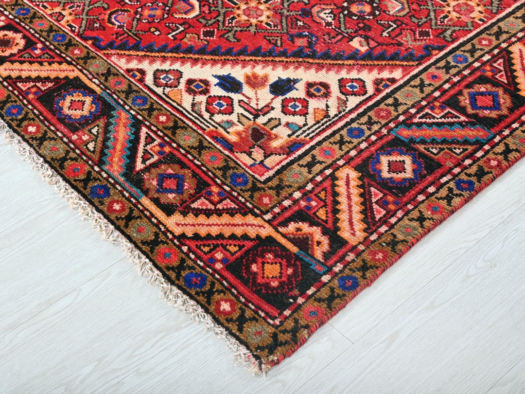 a colorful oriental rug on a white floor