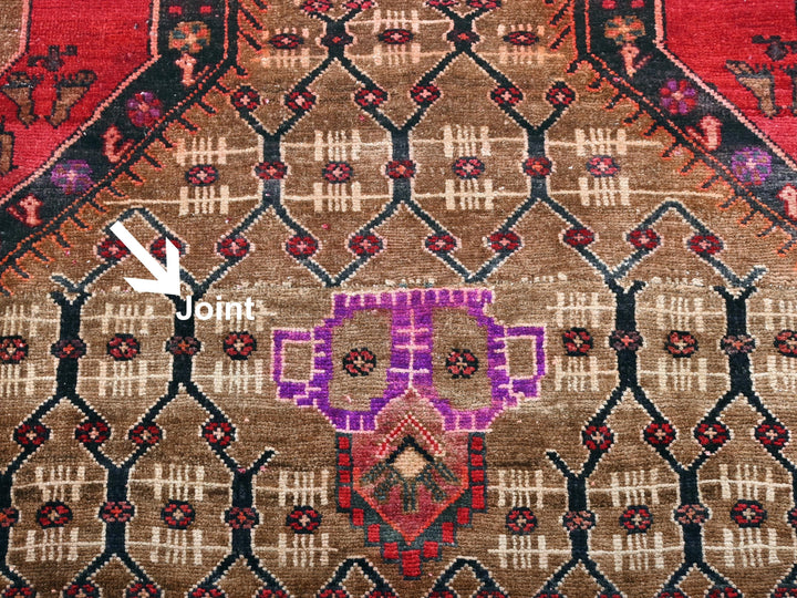 a close up of a rug with a purple design on it
