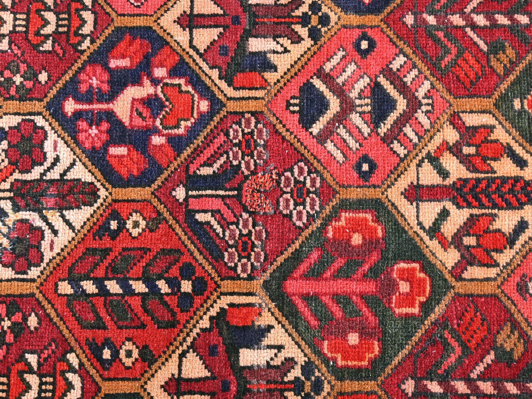 a red and blue rug with many different designs