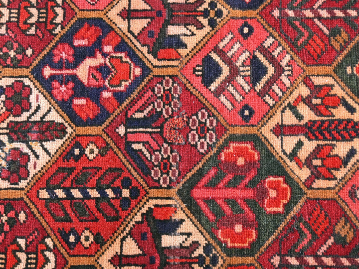 a red and blue rug with many different designs