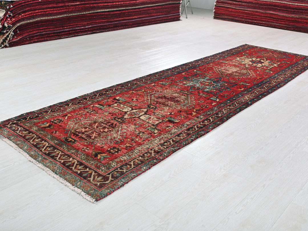 a red rug on the floor of a room