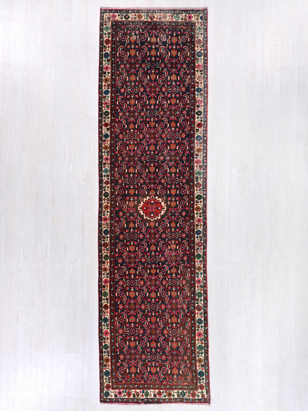 a rug hanging on a wall in a room