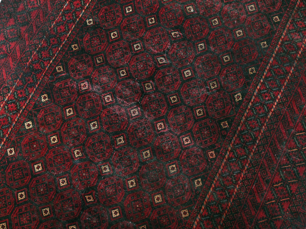 a close up of a red and black tie