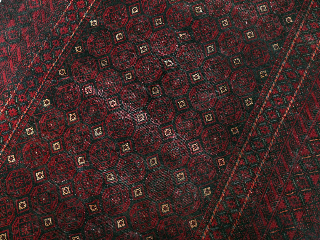 a close up of a red and black tie
