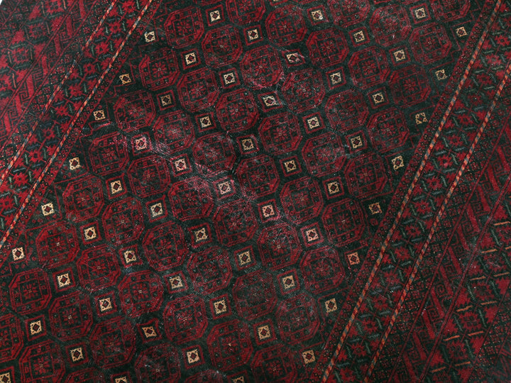 a close up of a red and black tie