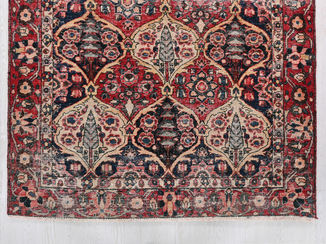 a red and blue rug with an intricate design