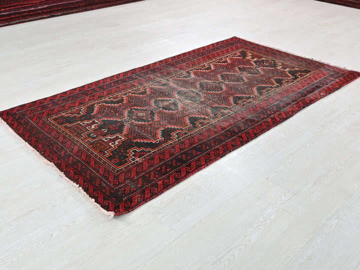 a red rug on the floor of a room