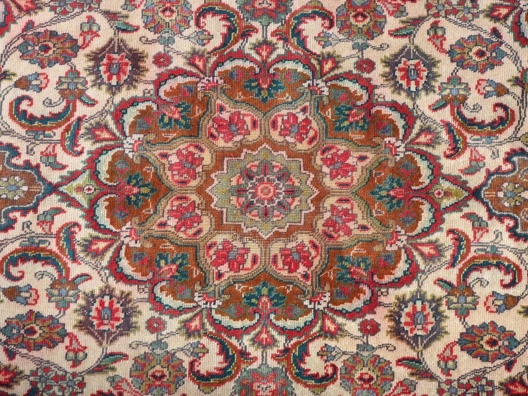 an oriental rug with a red, blue, and green design