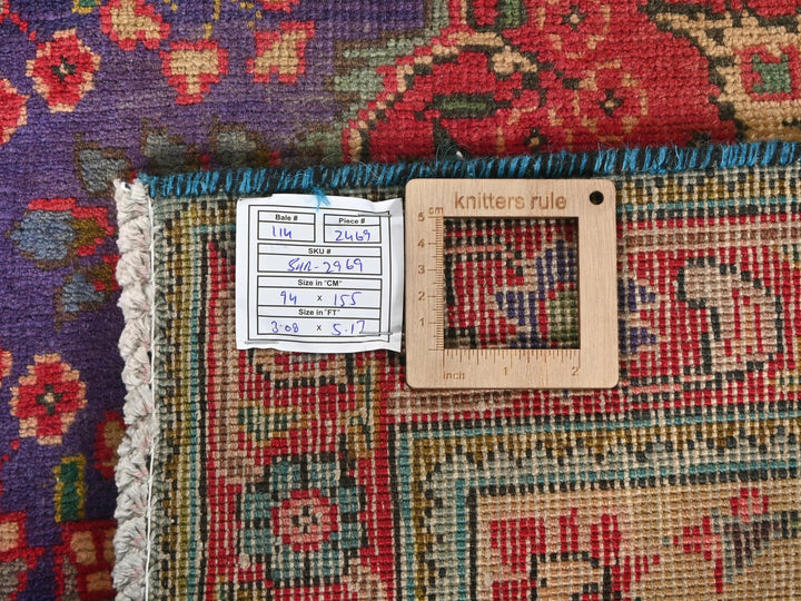 a piece of wood sitting on top of a rug