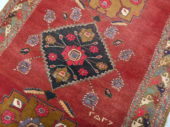 a close up of a red oriental rug