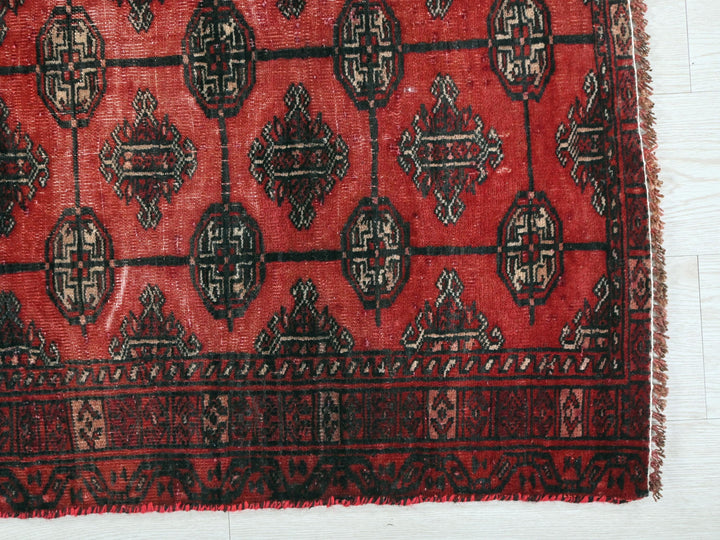 a close up of a rug on a wooden floor