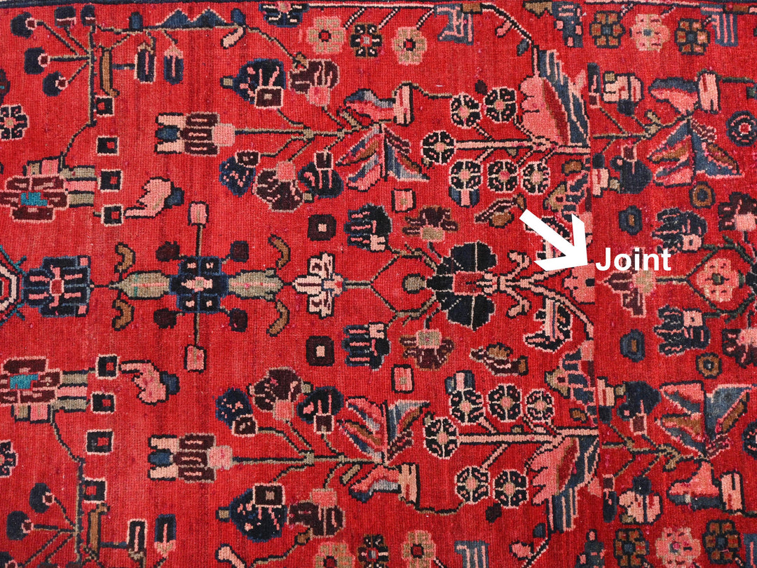 a red rug with a white arrow pointing to it