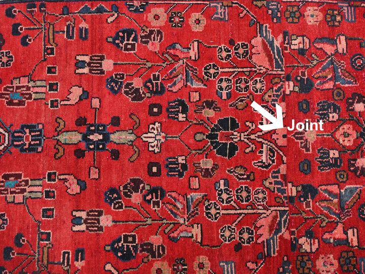 a red rug with a white arrow pointing to it