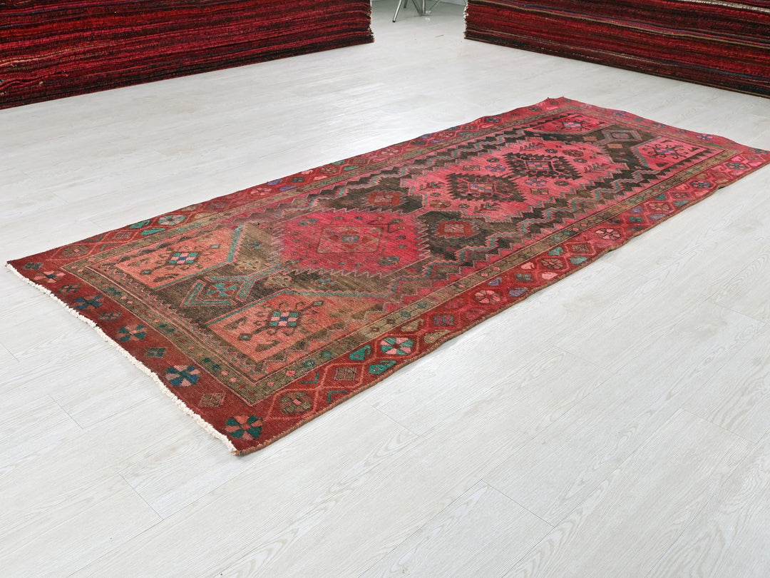 a red rug on the floor of a room