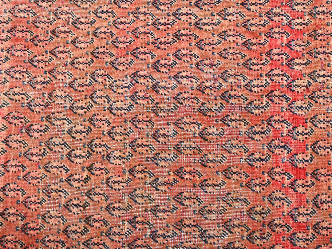 a red and blue rug with a pattern on it