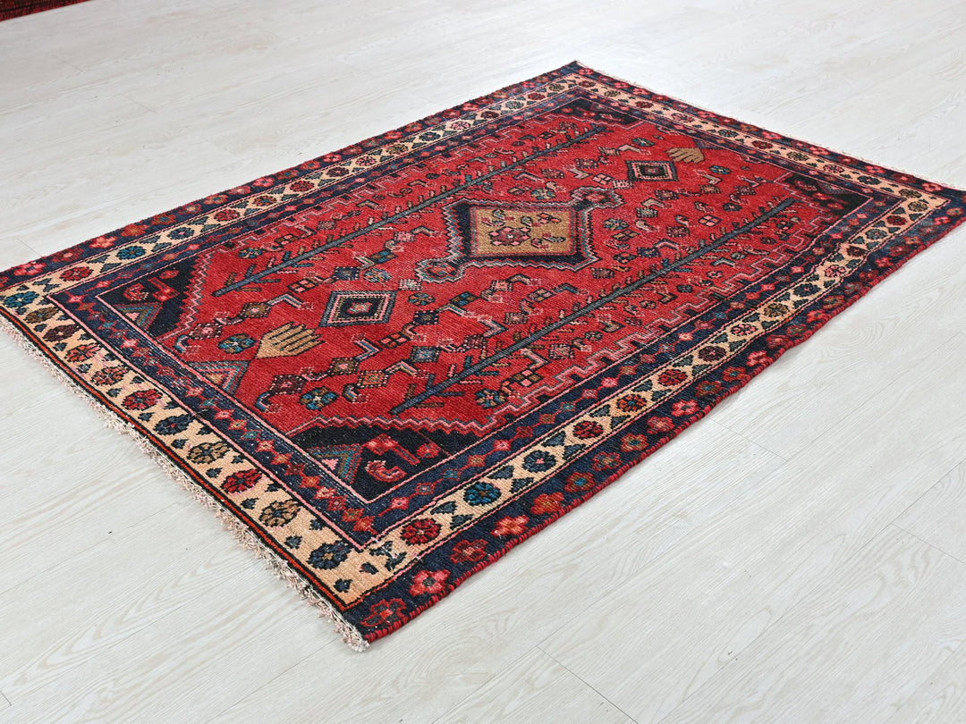 a red rug on the floor of a room