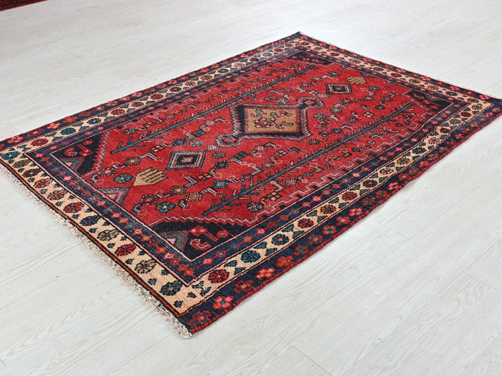 a red rug on the floor of a room