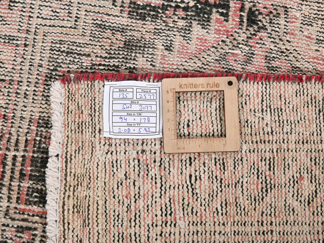 a piece of wood sitting on top of a rug