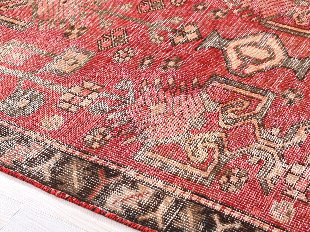 a close up of a rug on a wooden floor