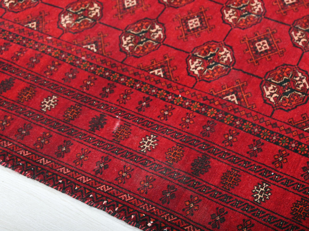 a close up of a red oriental rug