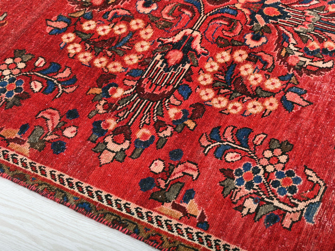 a close up of a red oriental rug