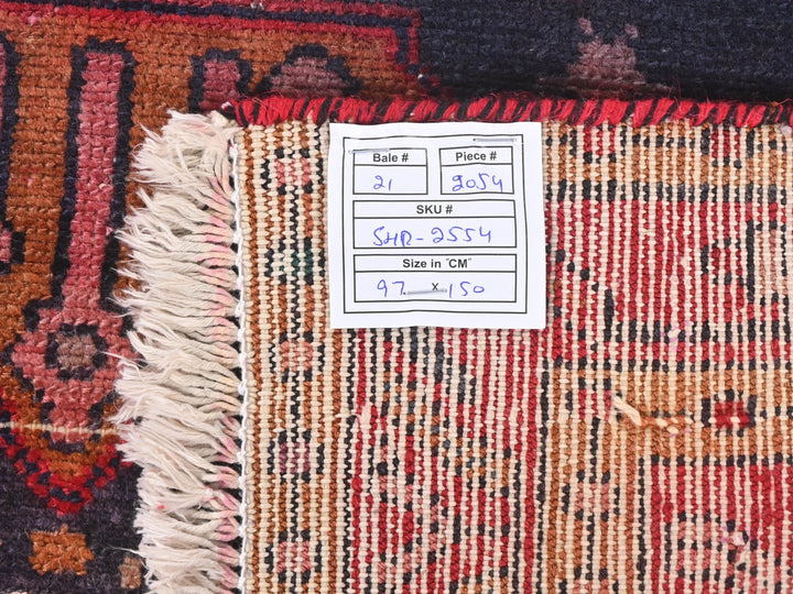 a pile of rugs with a price tag on them