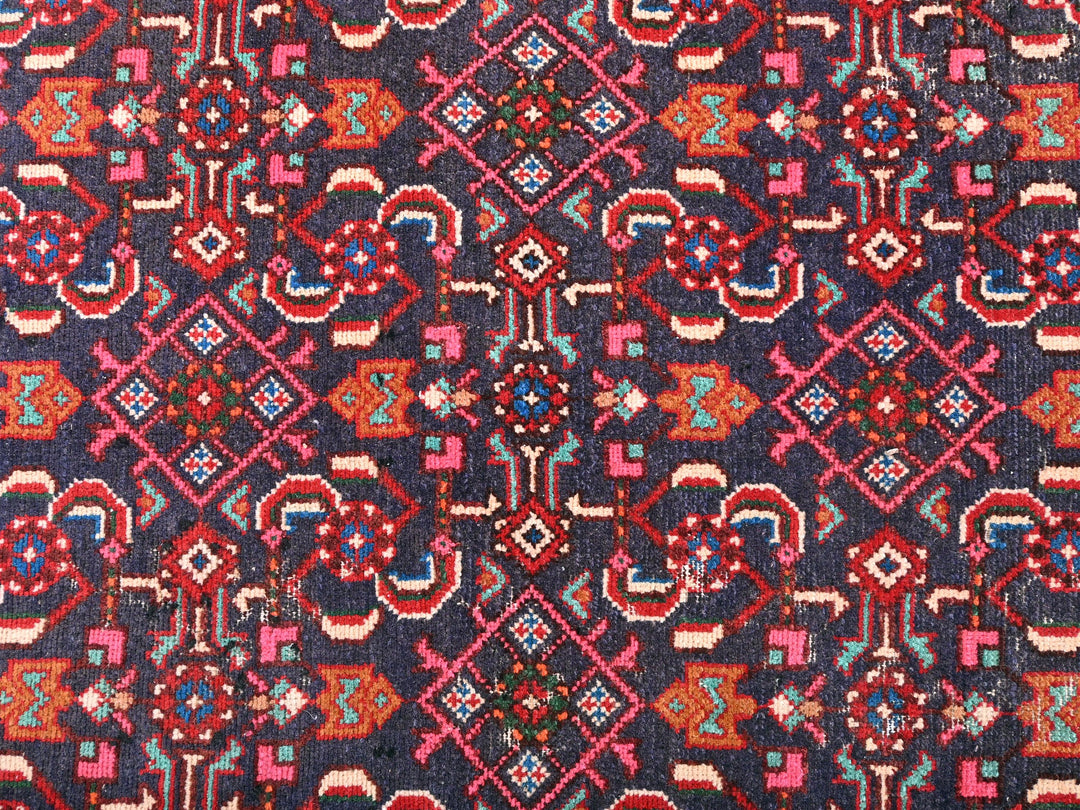 a blue and red rug with a pattern on it