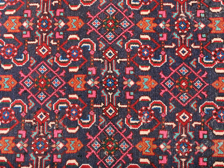 a blue and red rug with a pattern on it