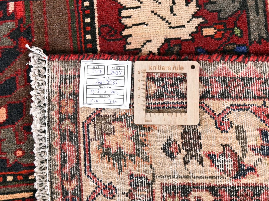 a pile of rugs with a tag on it