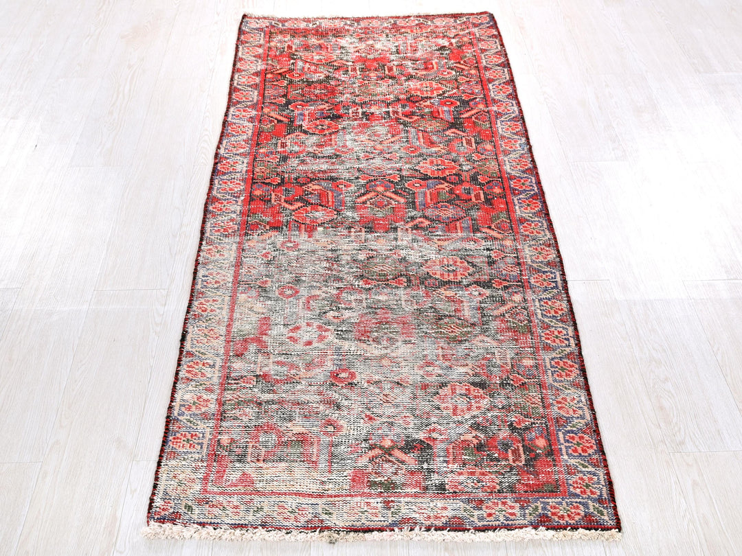 a red rug on a white floor in a room