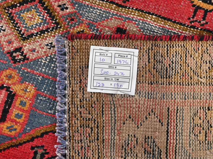 a pile of rugs with a price label on them