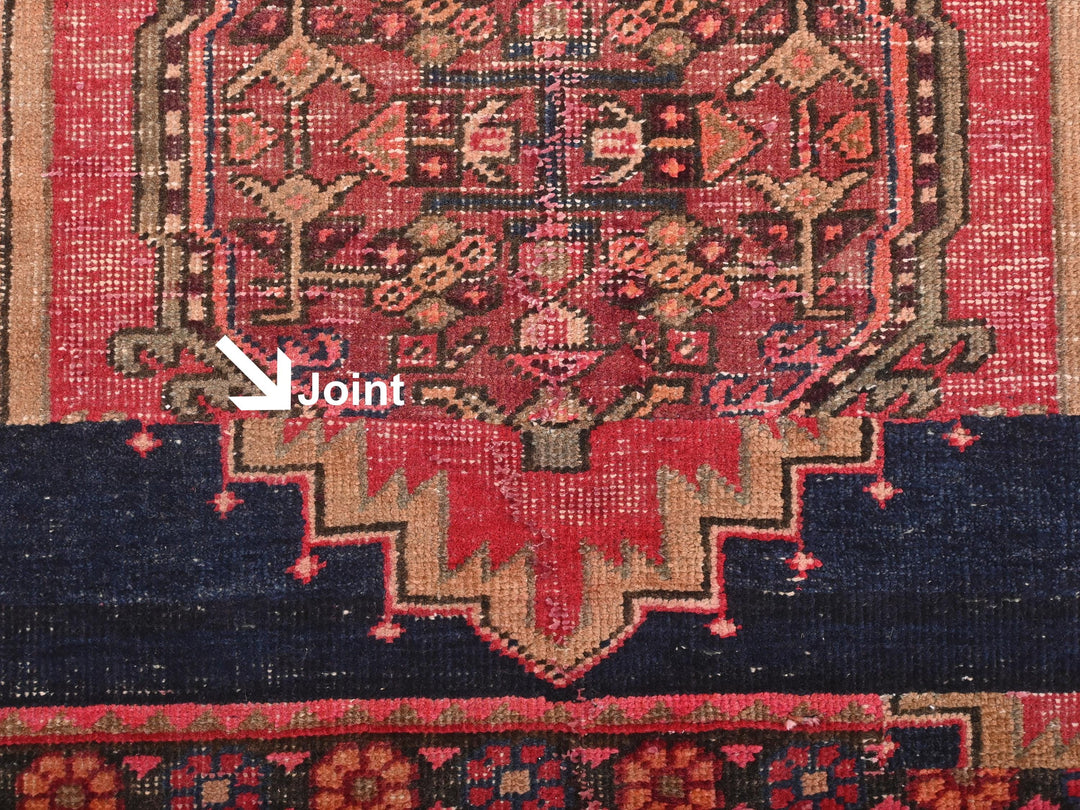 a close up of a rug with a red and blue design