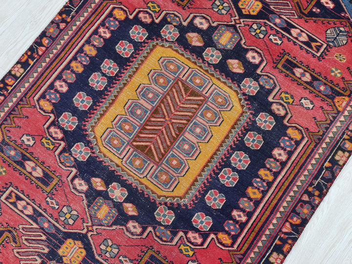 a colorful oriental rug on a wooden floor