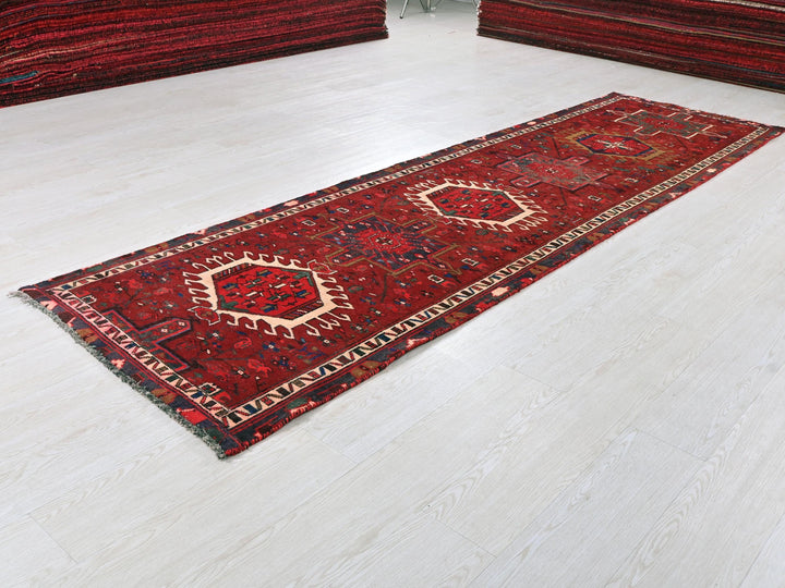 a red rug on the floor of a room