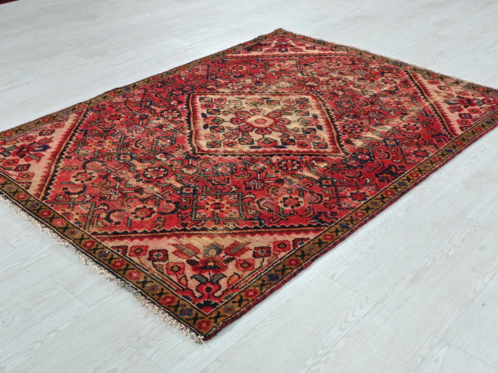 a red rug on the floor of a room