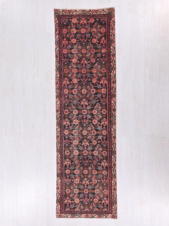 a rug hanging on a wall in a room