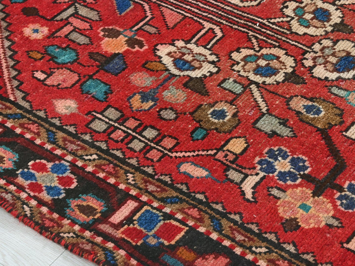 a close up of a red oriental rug