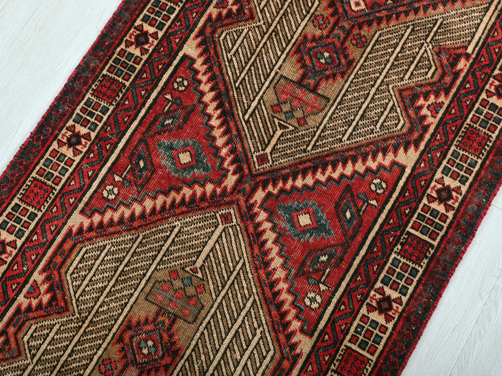 a close up of a rug on a wooden floor